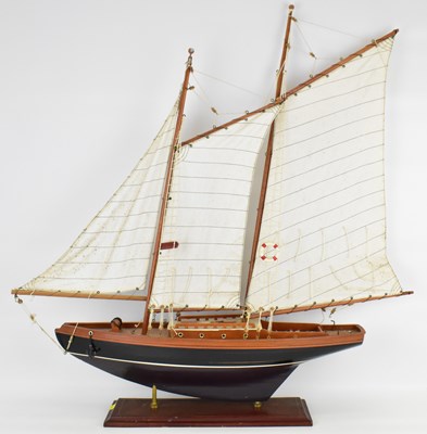 Lot 323 - A model of a three-masted yacht, mounted on...