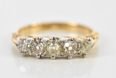 Lot 75 - An 18ct yellow gold five stone diamond ring,...