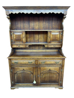 Lot 2199 - A reproduction oak dresser, the boarded plate...