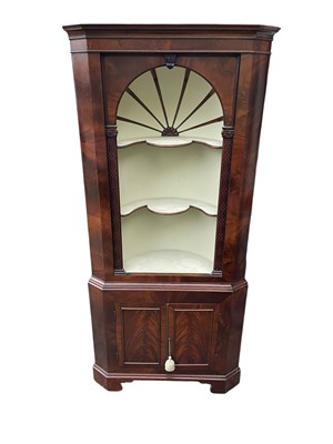 Lot 2179 - A Georgian mahogany freestanding corner...