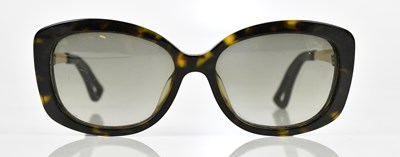 Lot 720 - CHRISTIAN DIOR; a pair of brown tortoiseshell...