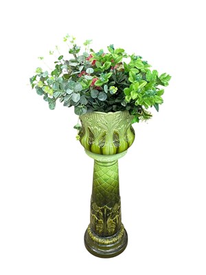 Lot 1622 - BURMANTOFTS; a faience jardiniere on stand...