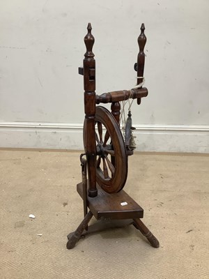 Lot 2066 - A country spinning wheel, height 84cm