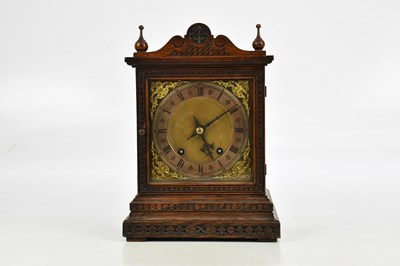 Lot 2268 - A German oak cased eight day mantel clock,...