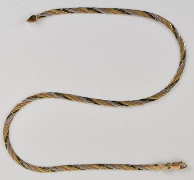 Lot 1434 - A 9ct tricolour gold semi-rigid necklace,...