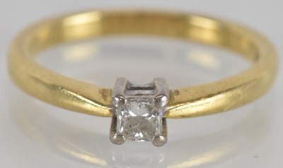 Lot 1259 - An 18ct yellow gold square cut diamond...