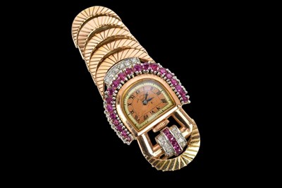 Lot 495 - An Art Deco style yellow metal ruby and...