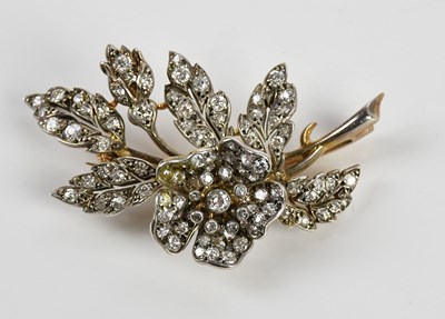 Lot 260 - A white metal diamond set floral brooch, with...