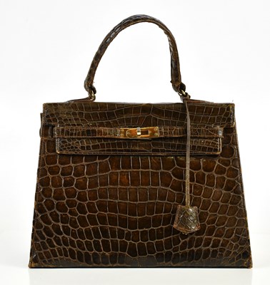 Lot 642 - A brown crocodile leather 1960s vintage Kelly...