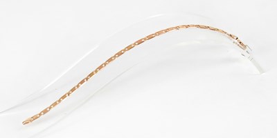 Lot 815 - A 9ct rose gold flat link bracelet, length...