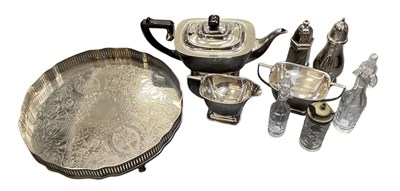 Lot 1013 - A three piece silver plated tea set, a silver...