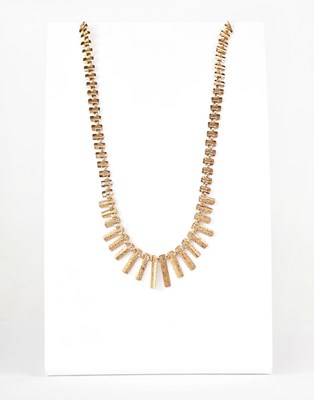 Lot 862 - A 9ct yellow gold Cleopatra necklace, the...