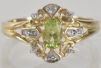 Lot 1335 - A 9ct gold dress ring, with central claw set...