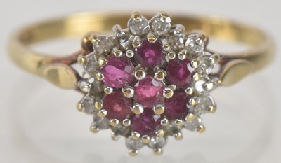 Lot 1339 - A 9ct gold ruby and white stone cluster ring,...
