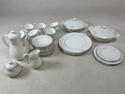 Lot 245 - ROYAL DOULTON; a dinner service and coffee set...