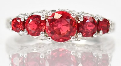 Lot 772 - A 14ct white gold ring set with five graduated...
