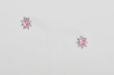 Lot 891 - A pair of 9ct white gold stud earrings set...