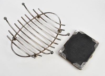 Lot 1069 - An Edwardian leather wallet with applied...