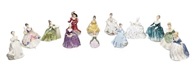 Lot 619 - ROYAL DOULTON; twelve assorted ceramic figures...