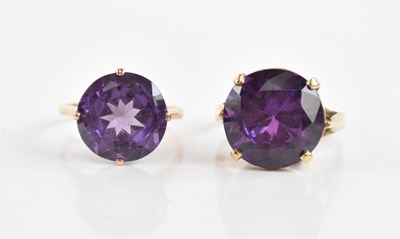 Lot 125 - Two yellow metal amethyst set dress rings,...