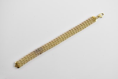 Lot 253 - A 9ct yellow gold hoop link broad bracelet,...