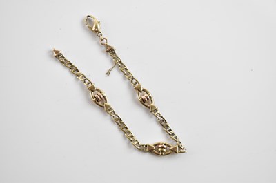 Lot 252 - A 9ct yellow gold bracelet, set with three...