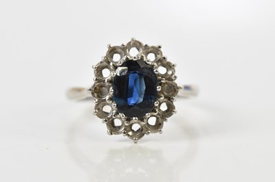 Lot 121 - An 18ct white gold sapphire dress ring, with a...