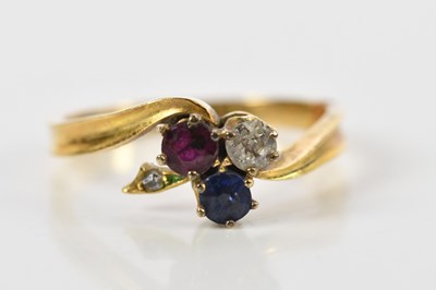 Lot 172 - An 18ct yellow gold diamond, ruby and sapphire...