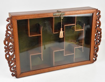 Lot 83 - A modern Chinese carved hard wood cabinet with...
