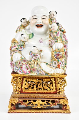 Lot 97 - A reproduction Chinese porcelain Buddha,...