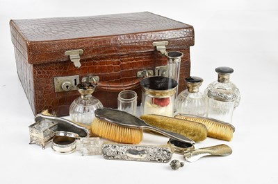 Lot 1336 - An early 20th century crocodile travel case...