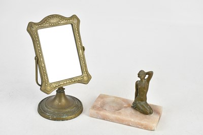 Lot 1421 - An Art Deco spelter model of a kneeling...