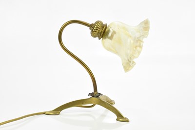 Lot 345 - An Arts & Crafts brass desk lamp with vaseline...