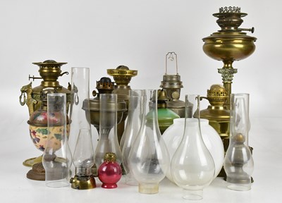 Lot 2405 - A collection of Victorian and later oil lamps,...