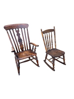 Lot 2170 - A 19th century elm rocking chair, with a child'...