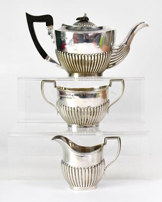 Lot 631 - W & E V; an Edwardian silver three-piece tea...