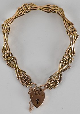 Lot 1610 - A 9ct rose gold four bar gate link bracelet...