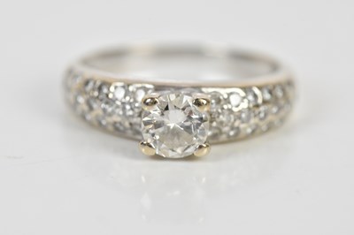 Lot 58 - A white metal diamond dress ring, set with a...