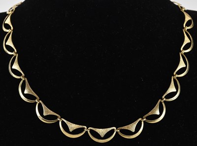 Lot 1405 - A 9ct gold fancy crescent link necklace,...