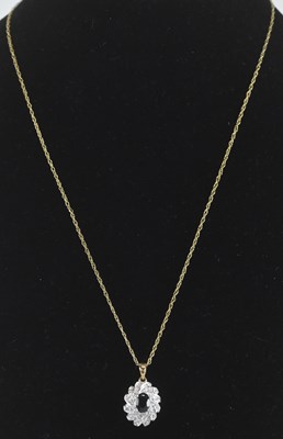 Lot 1420 - A 9ct white gold sapphire and diamond set...