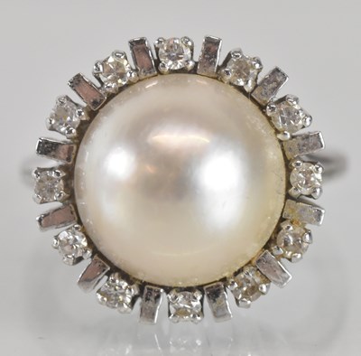 Lot 1236 - A Mabe pearl and diamond ring, the central...