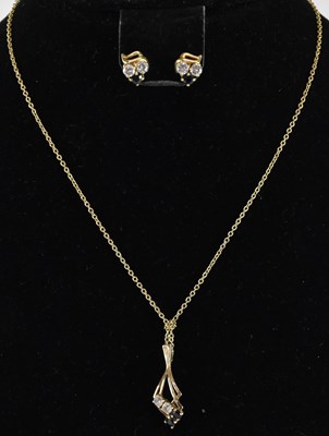 Lot 1468 - A pair of 9ct gold white and blue stone stud...