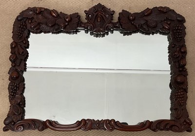 Lot 719 - A mahogany rectangular wall mirror, the...
