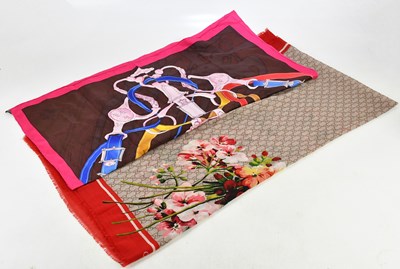 Lot 703 - GUCCI; a 100% wool GG monogram scarf, with red...