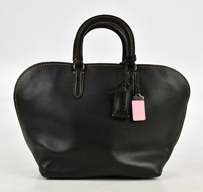 Lot 657 - COACH; a black glove tanned leather Dakota...
