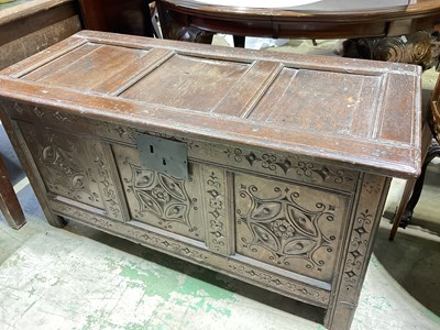 Lot 823 - An early 18th century oak coffer with triple...