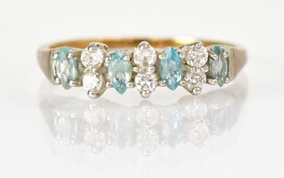 Lot 776 - A 9ct yellow gold ring set with pale blue...