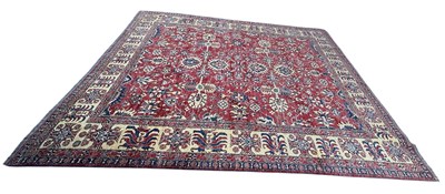 Lot 100 - A large modern red ground Kazak carpet,...