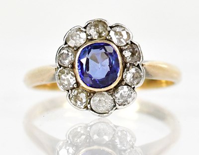 Lot 800 - A yellow metal diamond and sapphire floral...