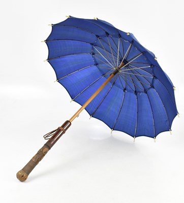 Lot 1297 - A parasol with a carved wooden handle, length...